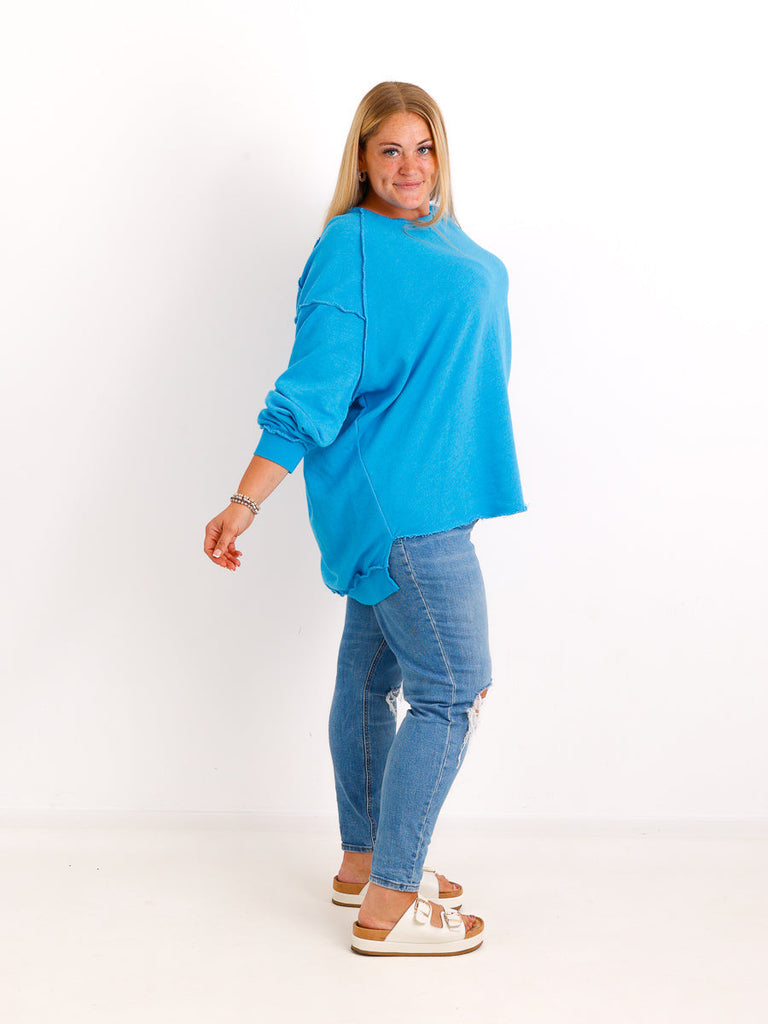 Silberstern Oversize-Sweater CARLY.S in Türkis aus reiner Baumwolle mit Inside-Out-Nähten und Vokuhila-Schnitt